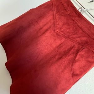 Red faux suede skirt with pockets.